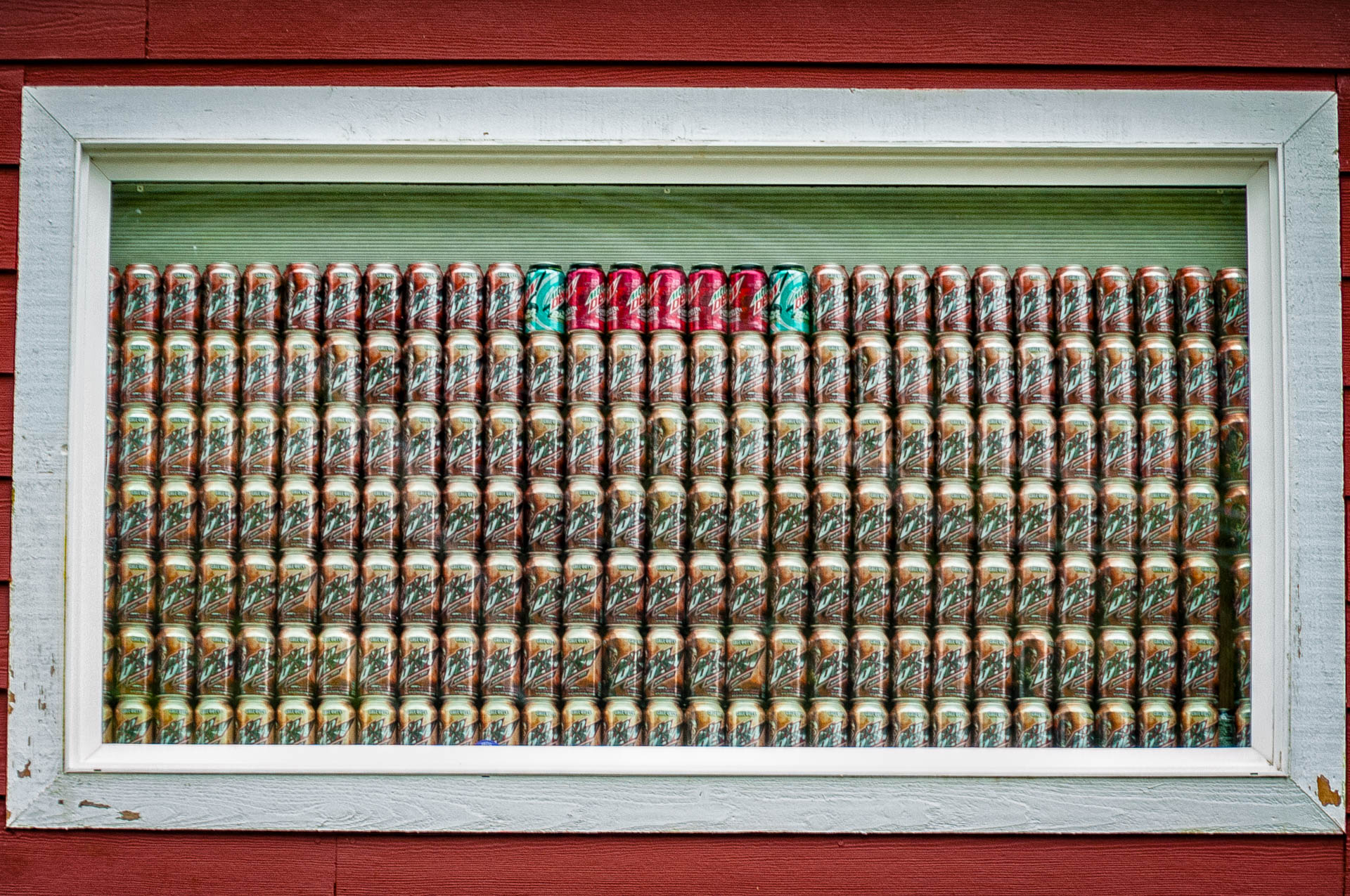 Beer can window covering in Ketchikan
