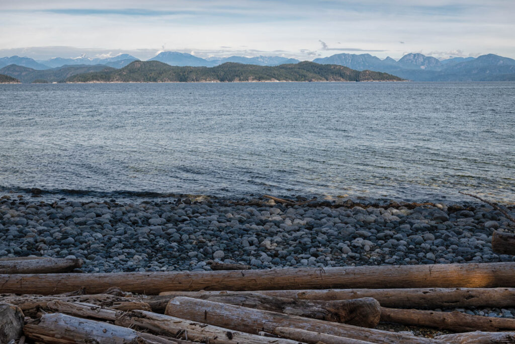 View of the Rocky Mountains from Rebecca Spit, Quadra Island | Focus On Mee | Robert Mee