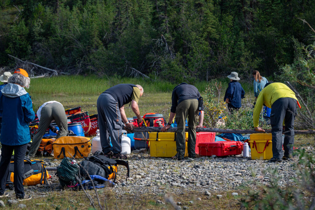 Breaking camp and loading the canoes for our paddle to Virginia Falls