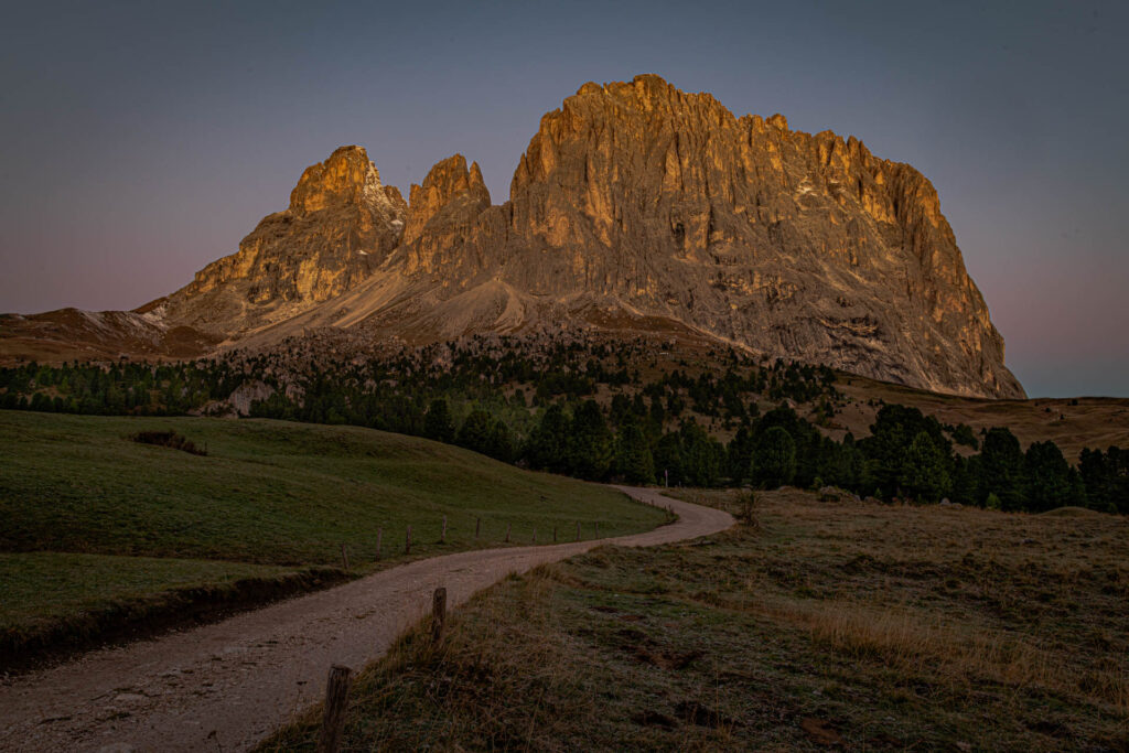 Sassolungo and surrounding mountains at sunrise (alpenglow)