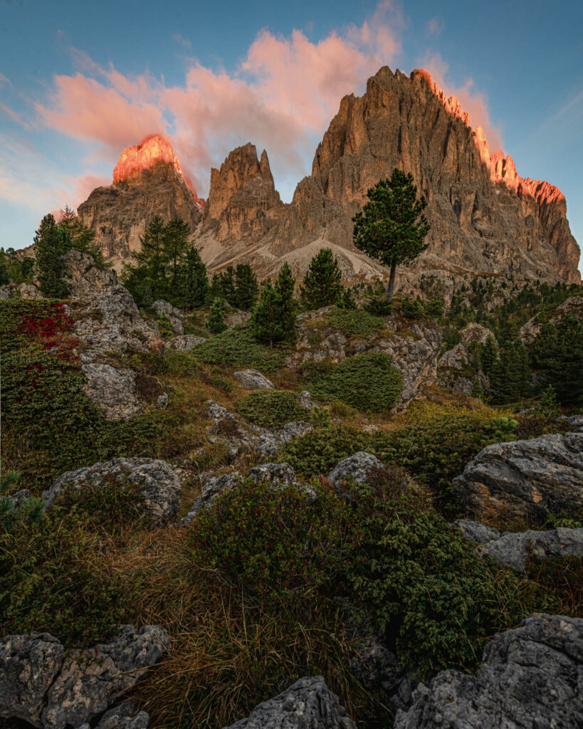 Sunrise (alpenglow) view of Sassolungo in the boulder field below Passo Sella