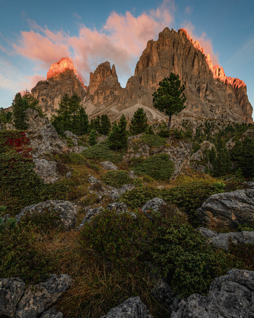 Sunrise (alpenglow) view of Sassolungo in the boulder field below Passo Sella